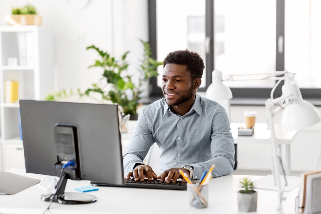 Man on computer completing his health assessment
